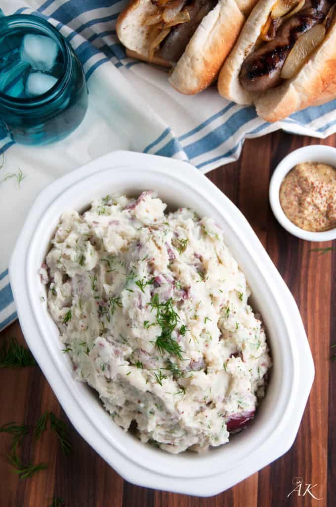 Fresh Dill and Red Potato Salad with mustard, hot dogs and blue glass