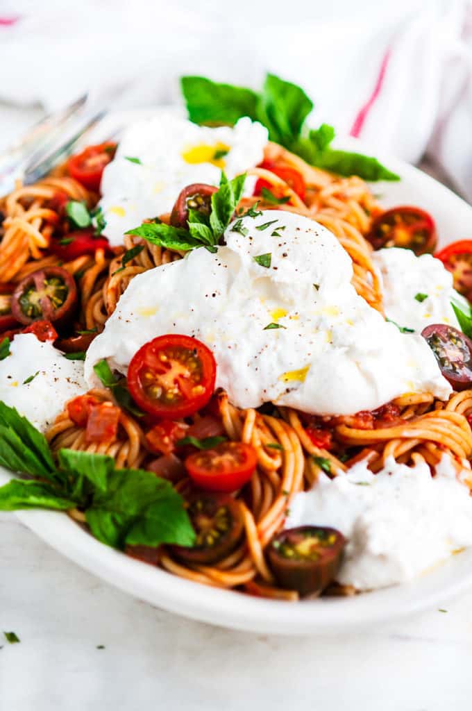 Tomato Basil Spaghetti with Burrata Close Up on a Serving Platter