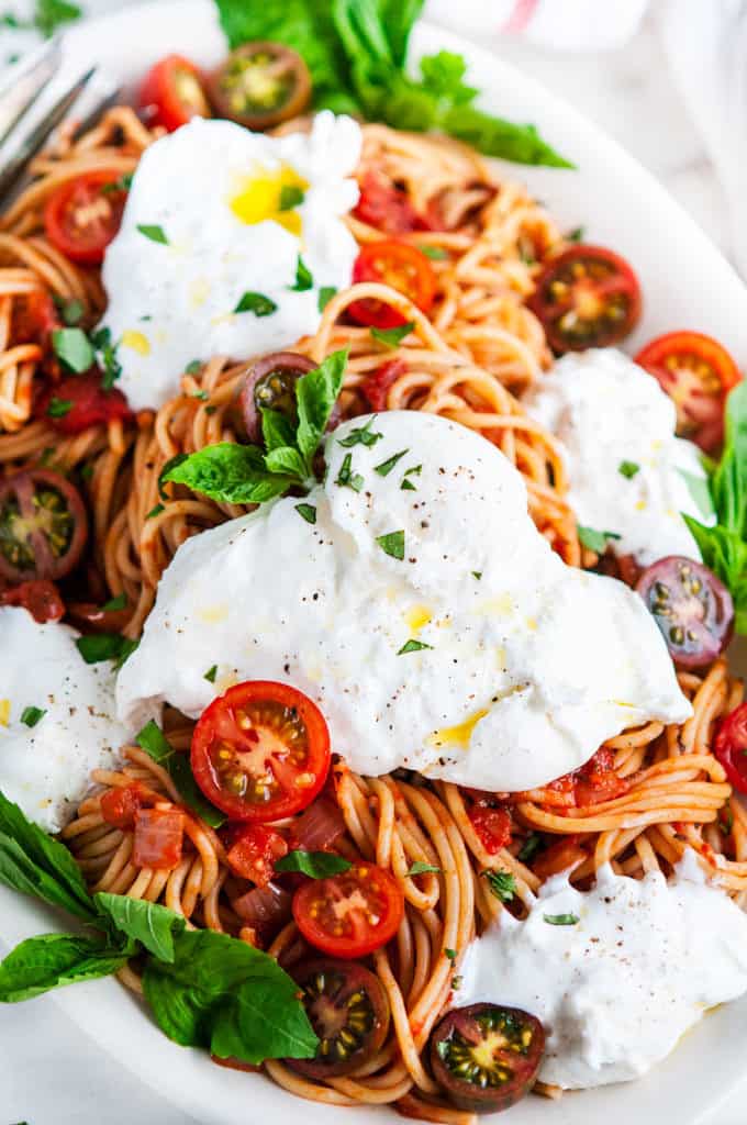 Tomato Basil Spaghetti with Burrata on a Serving Platter