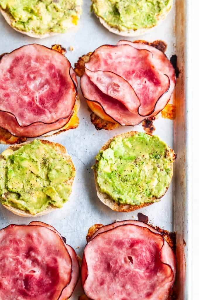 Make Ahead Freezer Breakfast Sandwiches on a sheet pan with avocado and ham