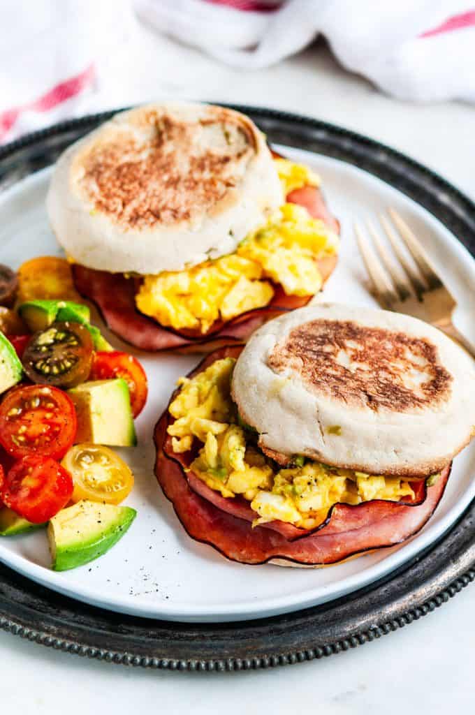 Make Ahead Freezer Breakfast Sandwiches with eggs, ham, avocado, and tomato salad