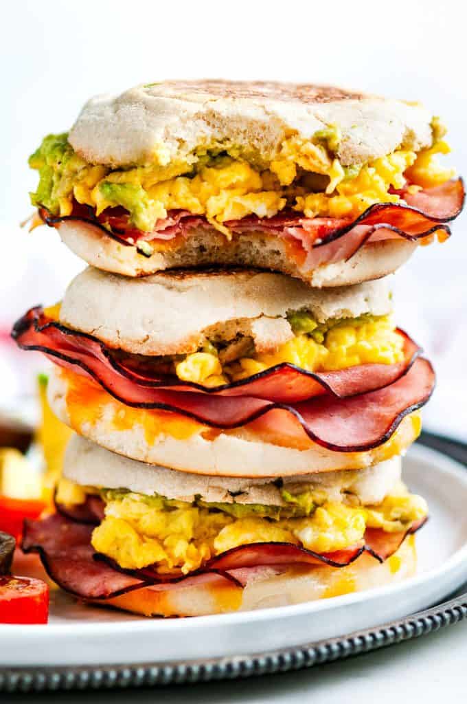 Make Ahead Freezer Breakfast Sandwiches stack with eggs, ham, and avocado