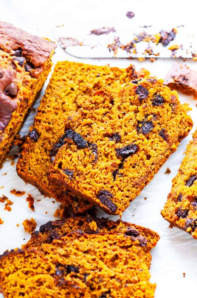 Chocolate chip pumpkin bread slices with knife
