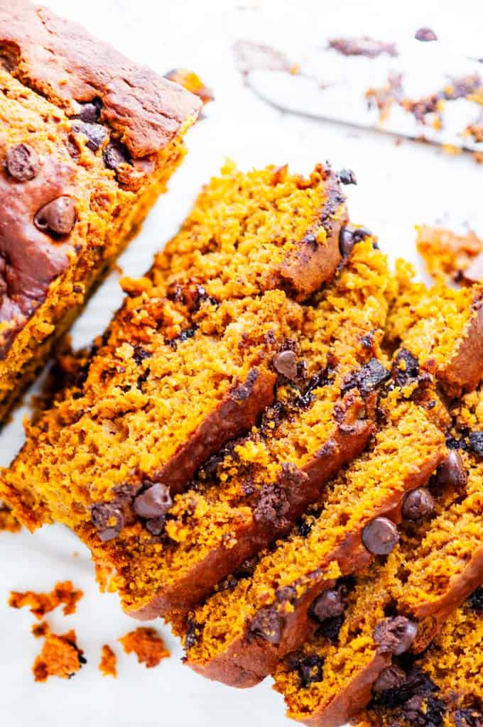 Chocolate chip pumpkin bread slices with knife