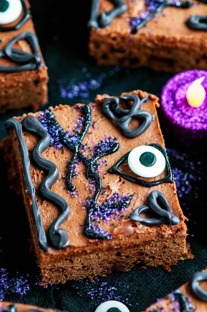 Hocus Pocus Brownies decorated as Winifred's Spell Book on black fabric with glittery candles