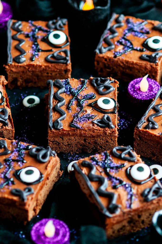 Hocus Pocus Brownies decorated as Winifred's Spell Book on black fabric with glittery candles