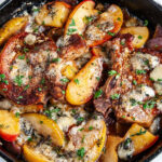Skillet Blue Cheese Pork Chops with Apples and Pears in lodge cast iron on white marble