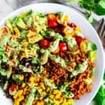 Turkey Taco Salad with Cilantro Avocado Dressing in a white bowl with antique silver fork