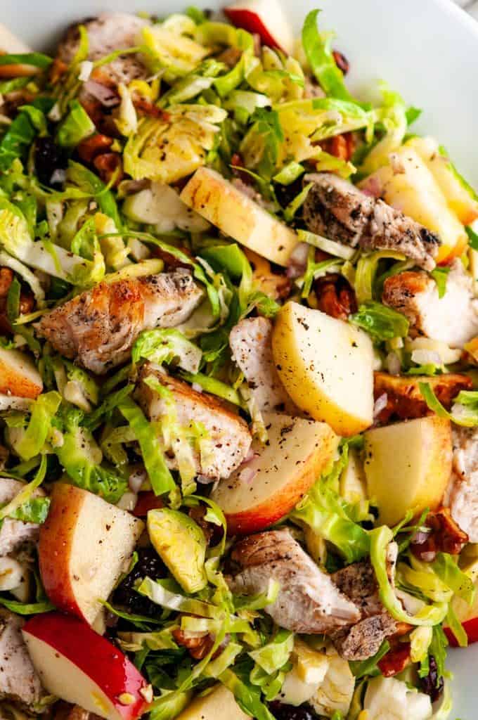 Chicken Apple Brussels Sprouts Salad in white bowl