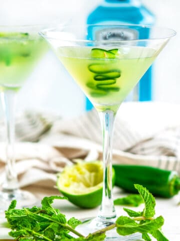 Jalapeño Cucumber Martini with bombay sapphire gin, tea towel on white marble