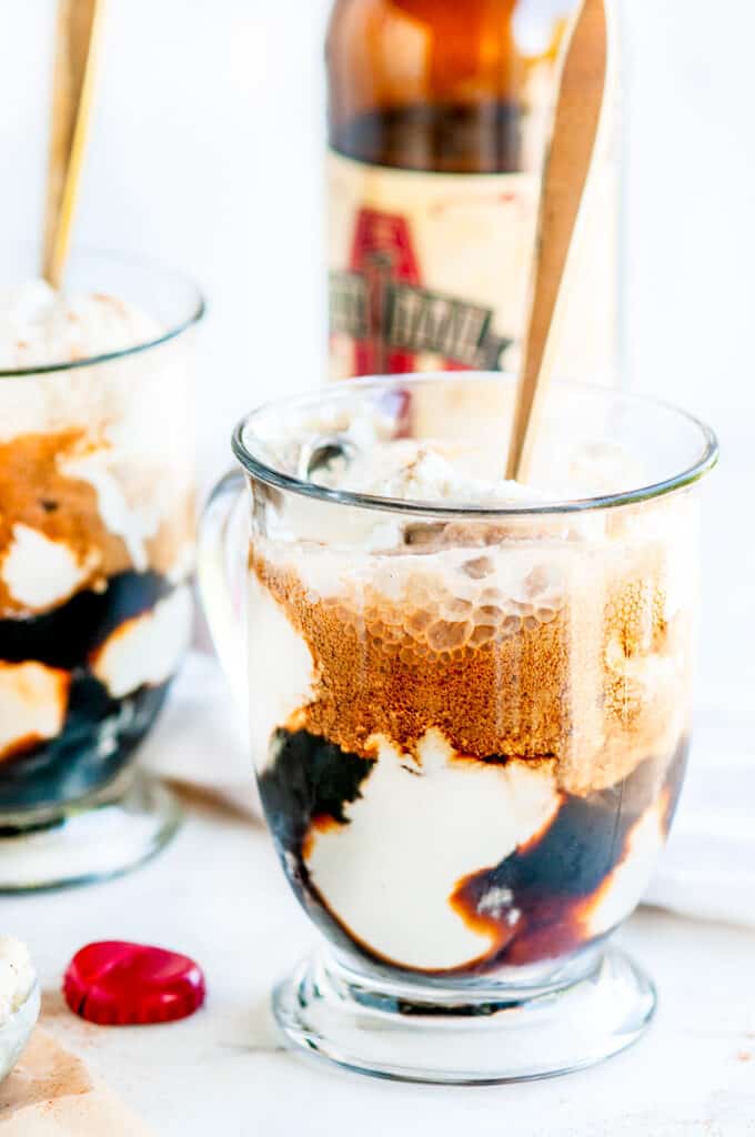 Stout Float with No-Churn Vanilla Ice Cream in glass mugs with gold spoons and bottle