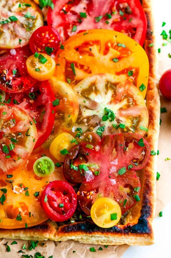Heirloom Tomato Goat Cheese Tart on parchment paper