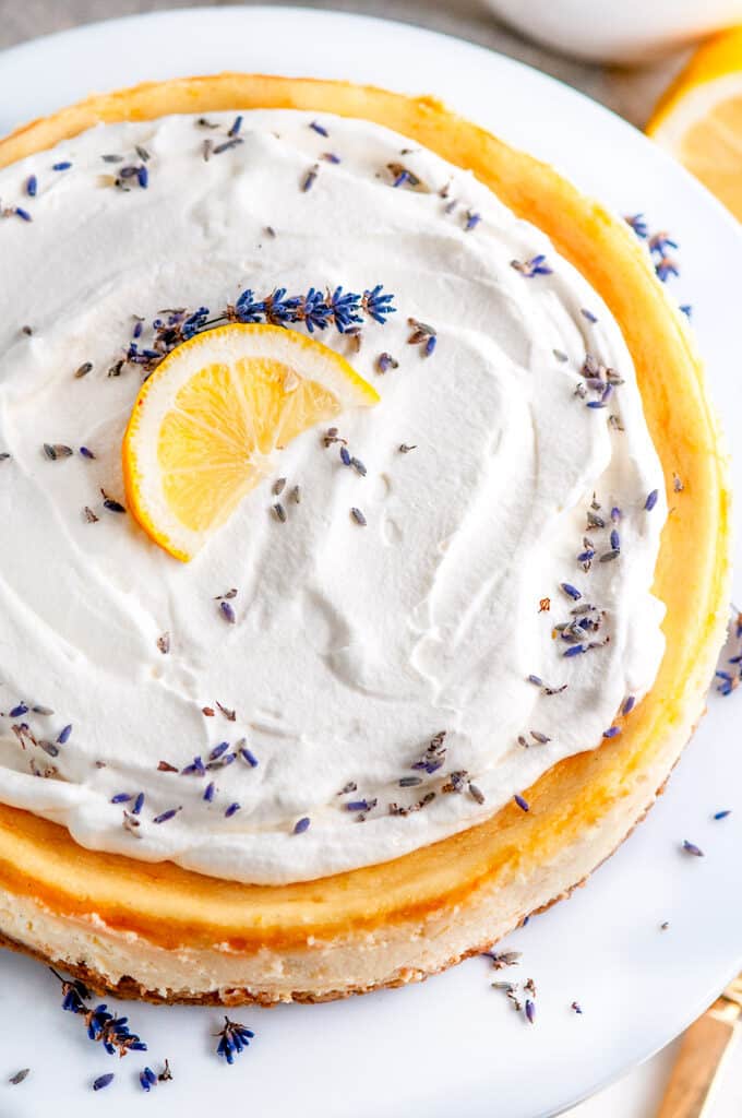 Lemon Lavender Mascarpone Cheesecake on white cake stand