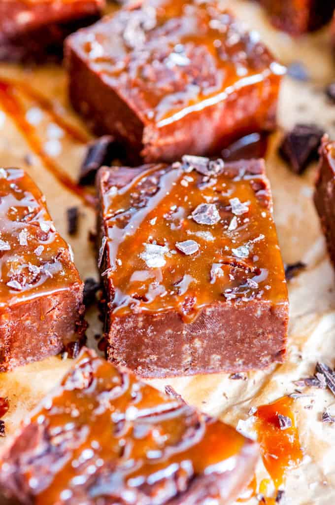 Salted Caramel Chocolate Fudge square close up on brown parchment paper