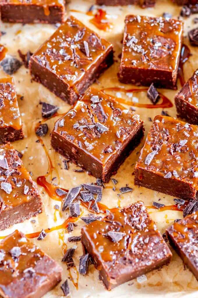Salted Caramel Chocolate Fudge squares on brown parchment paper