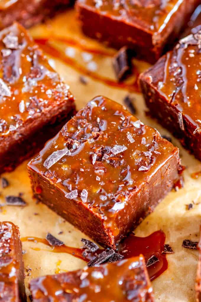 Salted Caramel Chocolate Fudge square close up on brown parchment paper