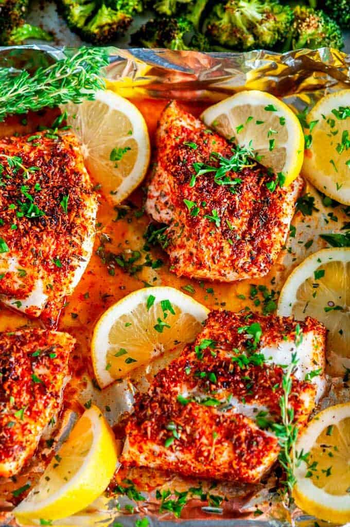 Sheet Pan Paprika Parmesan Cod with Broccoli in foil with lemons and herbs