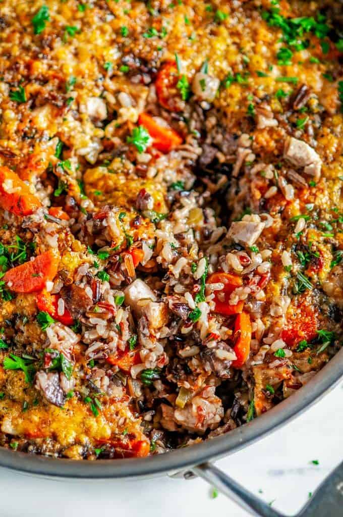 One Pot Turkey Wild Rice Casserole in all clad skillet on white marble close up