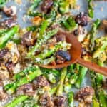 Roasted Panko Asparagus and Mushrooms on sheet pan with wooden spoon close up