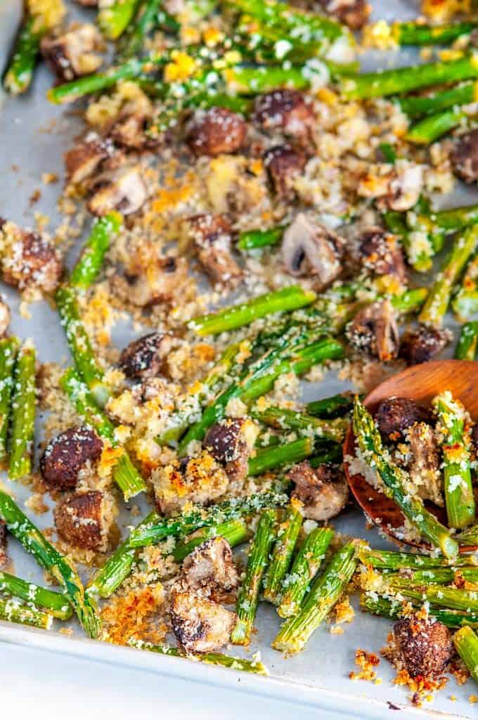 Roasted Panko Asparagus and Mushrooms on sheet pan with wooden spoon