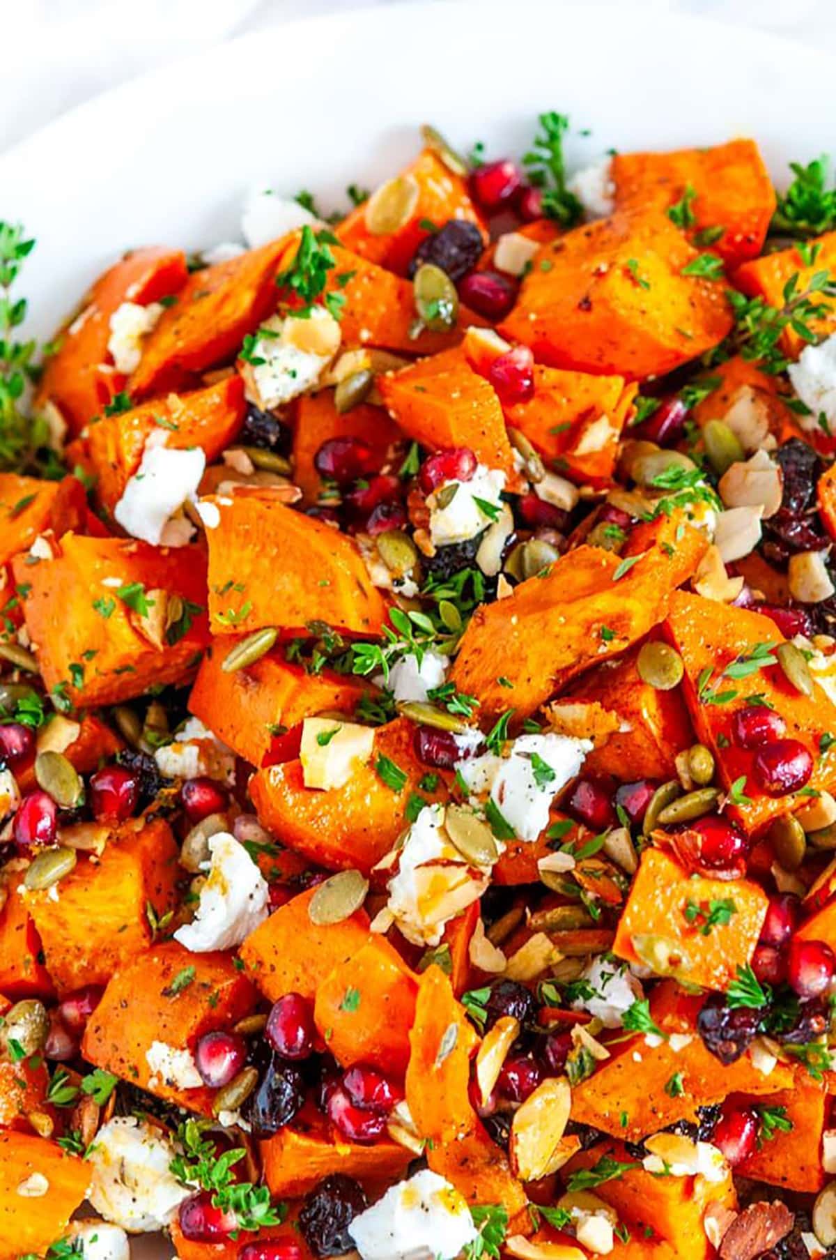Roasted Sweet Potato Salad in white bowl on marble close up