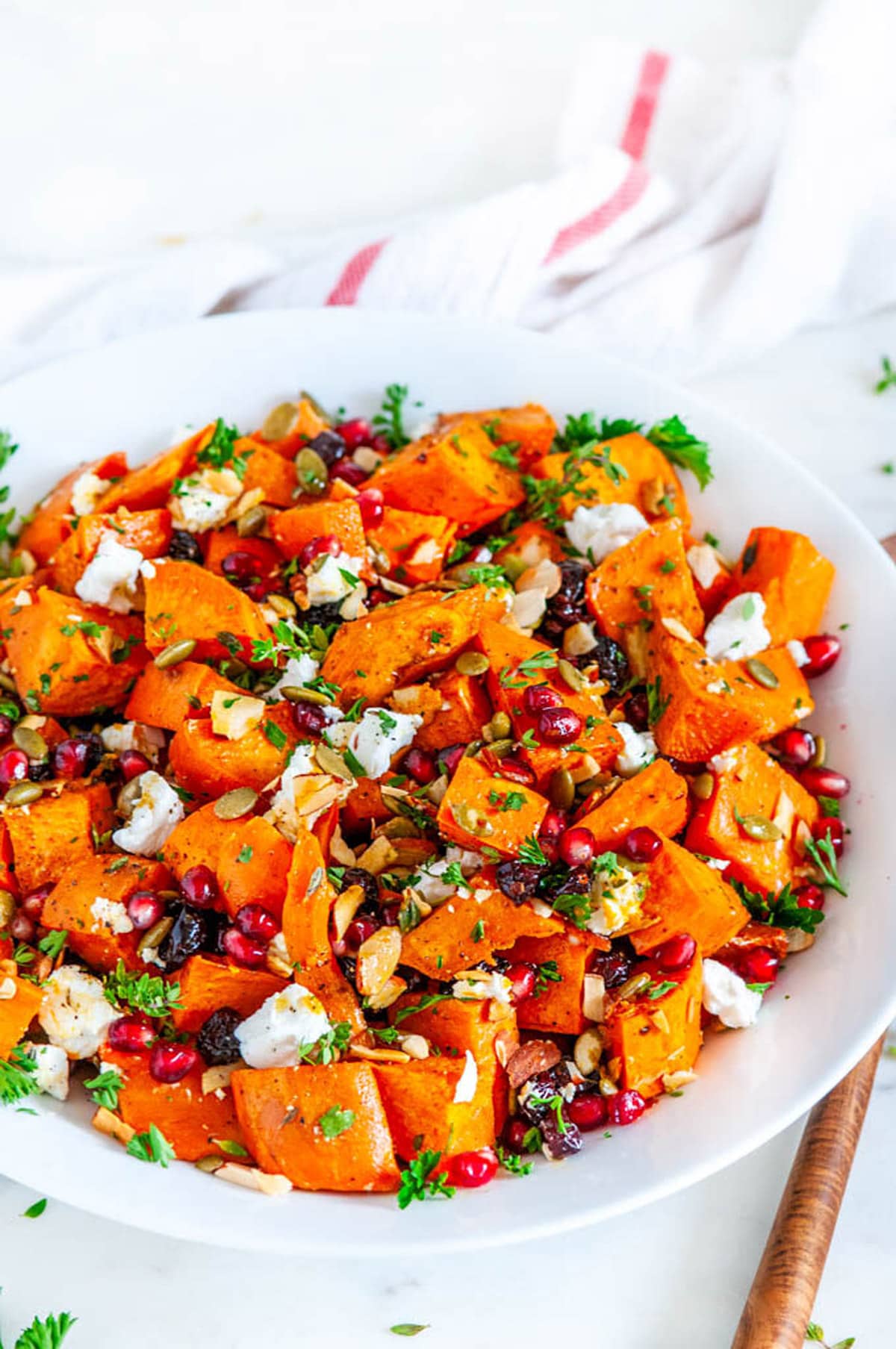 Roasted Sweet Potato Salad in white bowl on marble close up