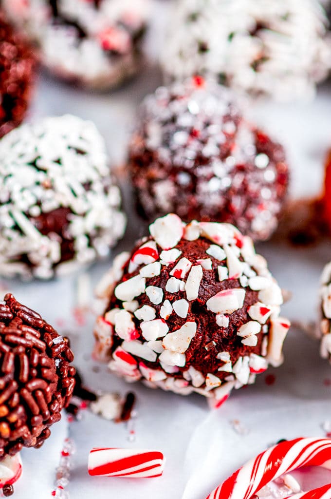 Homemade Chocolate Truffles with sprinkles, and candy canes close up