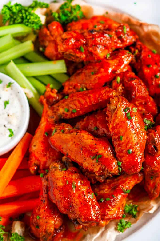 Crispy Buffalo Chicken Wings (Air Fryer + Oven Baked Methods) with carrots, celery and blue cheese dressing