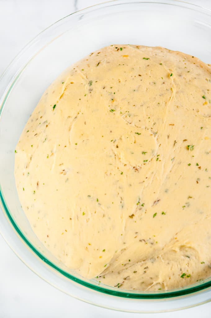 Honey Lavender Herb Dinner Rolls dough in glass bowl