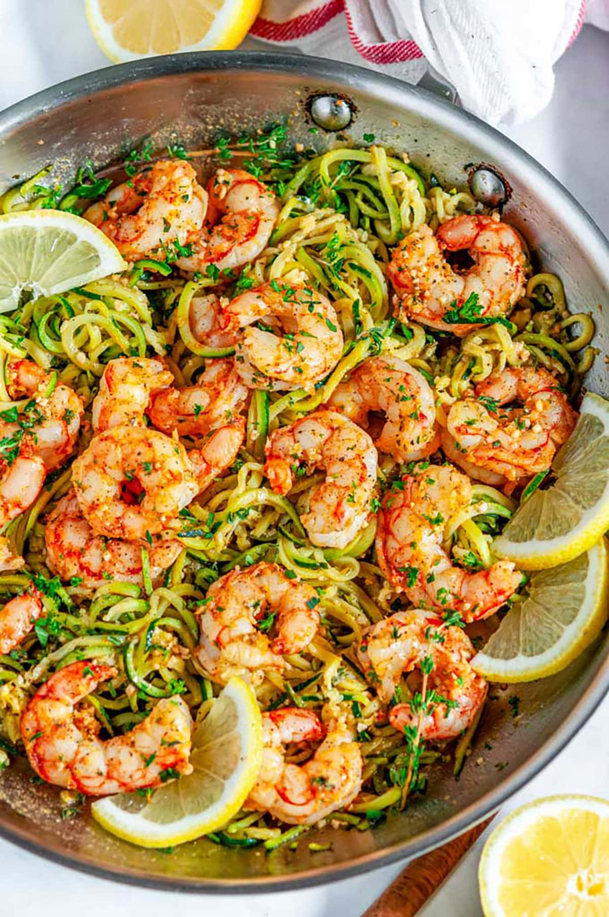 Skillet Shrimp Zucchini Noodles with lemon in silver all clad skillet over head