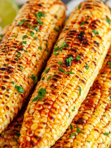 Grilled Chili Lime Honey Butter Corn on the Cob side view close up
