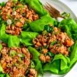 PF Chang's Chicken Lettuce Wraps (Copycat Recipe) on gray plate with gold fork close up