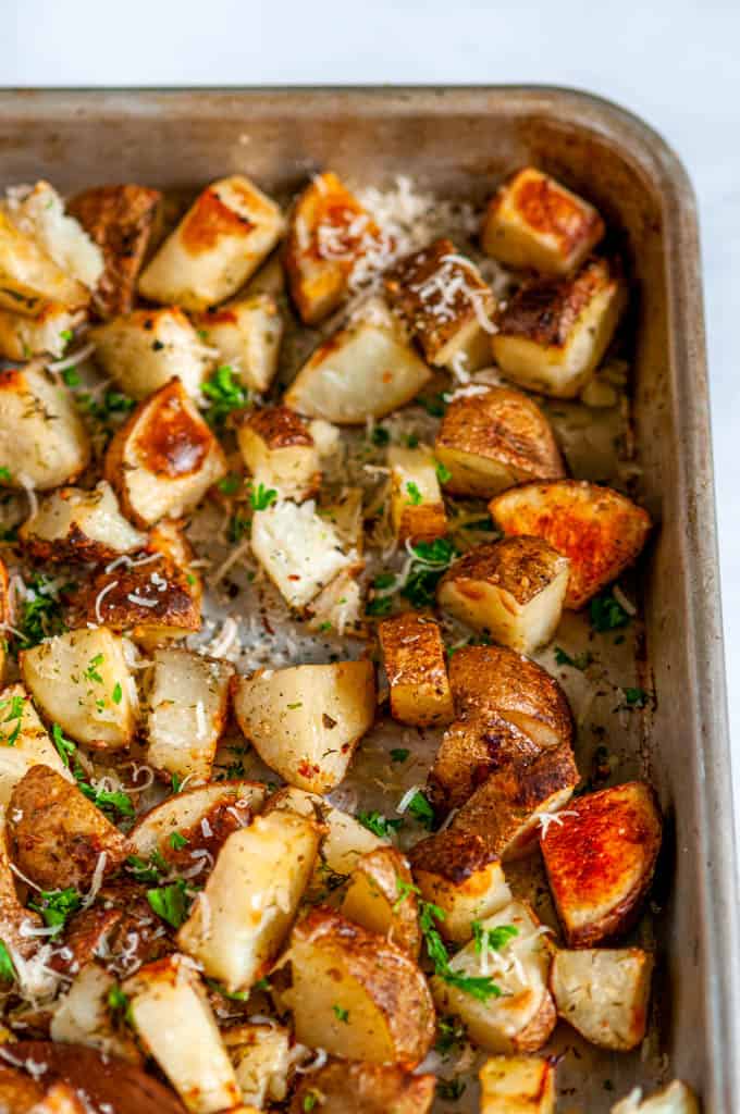 Parmesan Garlic Roasted Potatoes on sheet pan close up