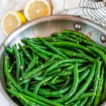 Easy Skillet Garlic Green Beans two images with blue rectangle and white text overlay in all-clad skillet with tea towel and lemons