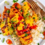 Easy Grilled Tandoori Chicken on white plate with gold silverware