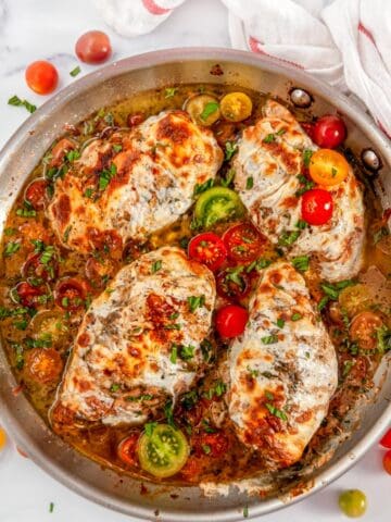 Quick & Easy Skillet Chicken Caprese with cherry tomatoes and pan sauce in All-Clad Skillet