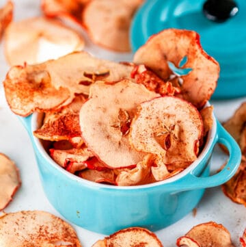Healthy Baked Apple Chips in mini aqua blue cocette on white marble