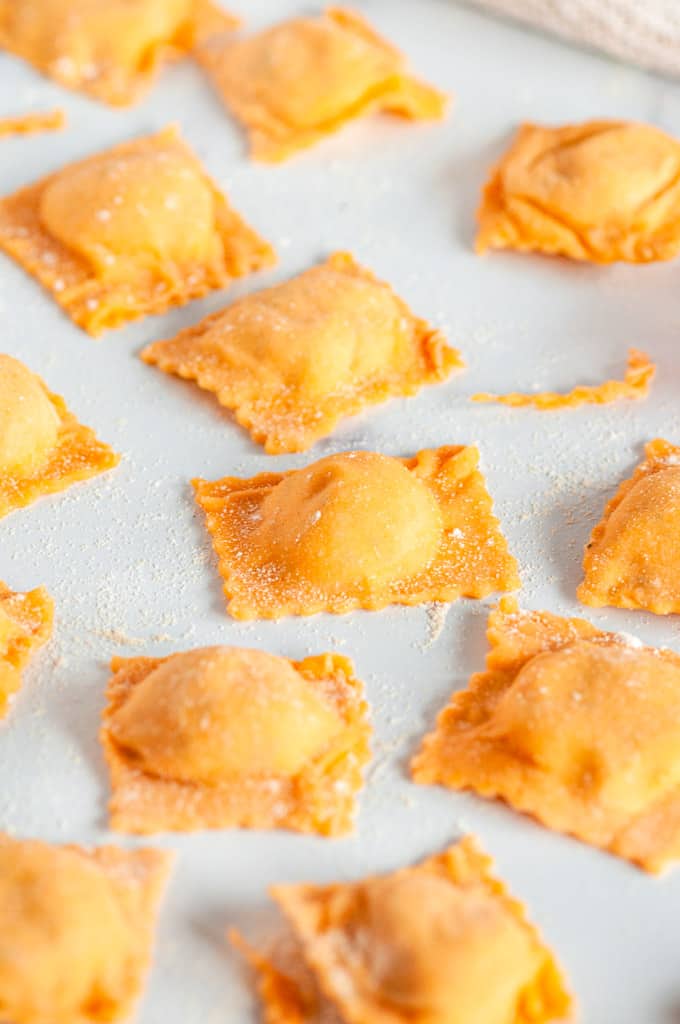 Homemade Butternut Squash Ravioli uncooked on white marble