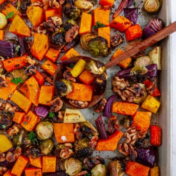 Autumn Harvest Roasted Vegetables on sheet pan with wooden spoon