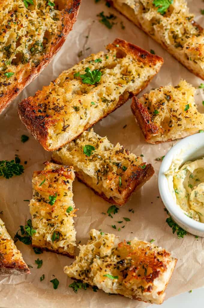 Herbed Butter Garlic Bread sliced on parchment paper