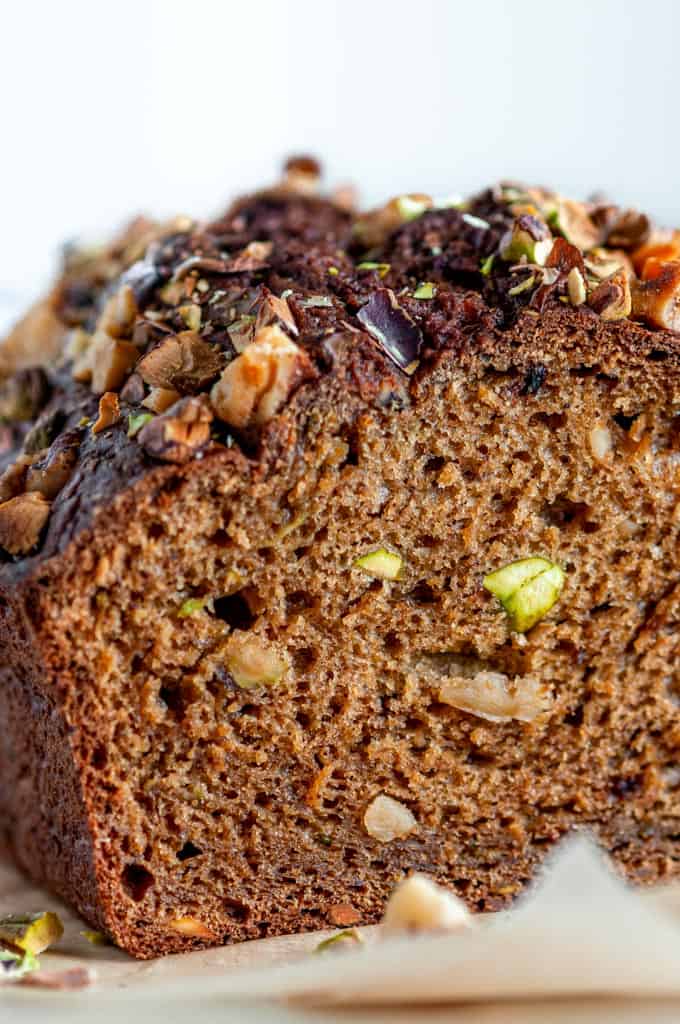 Nutty Banana Avocado Bread loaf on brown parchment paper