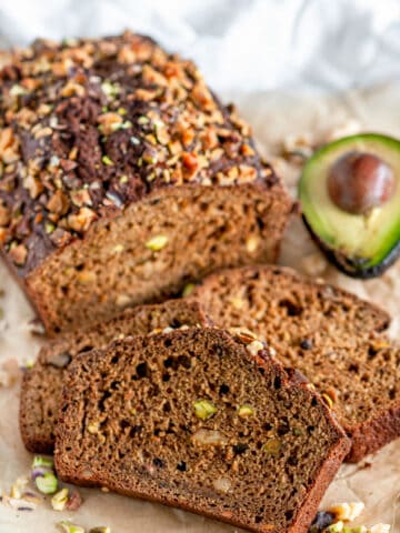 Nutty Banana Avocado Bread sliced on brown parchment paper
