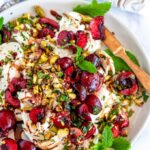 Balsamic Cherry Mint Burrata with pistachios on white plate