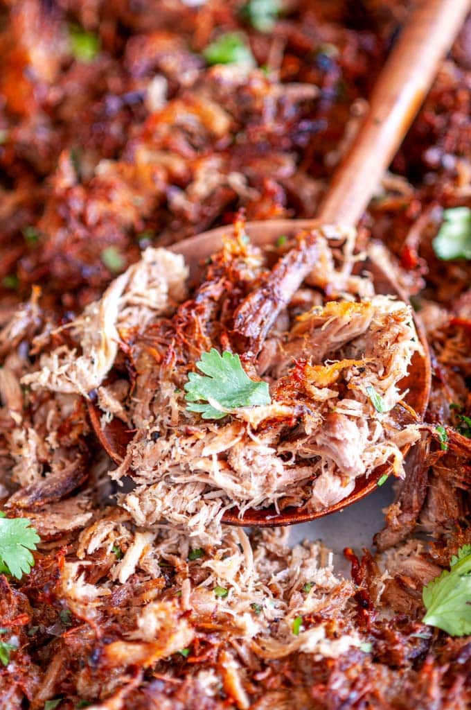 Cuban Inspired Instant Pot Pulled Pork on sheet pan with wooden spoon