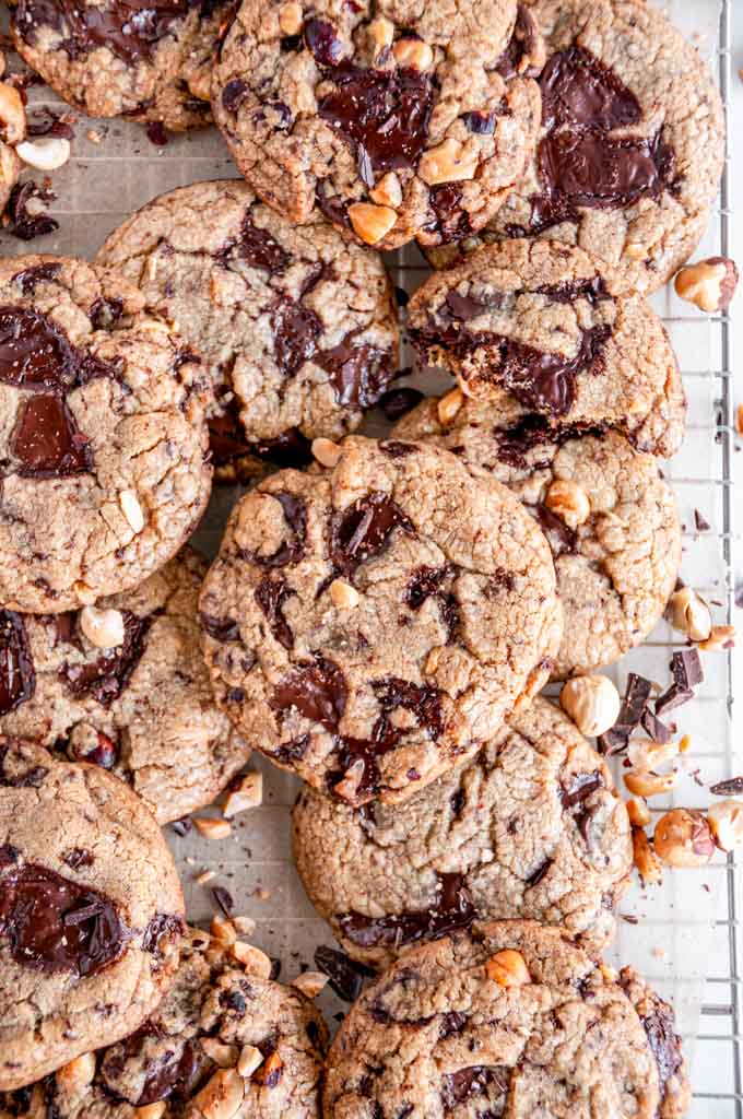 Brown Butter Chocolate Chunk Hazelnut Cookies on parchment with wire rack