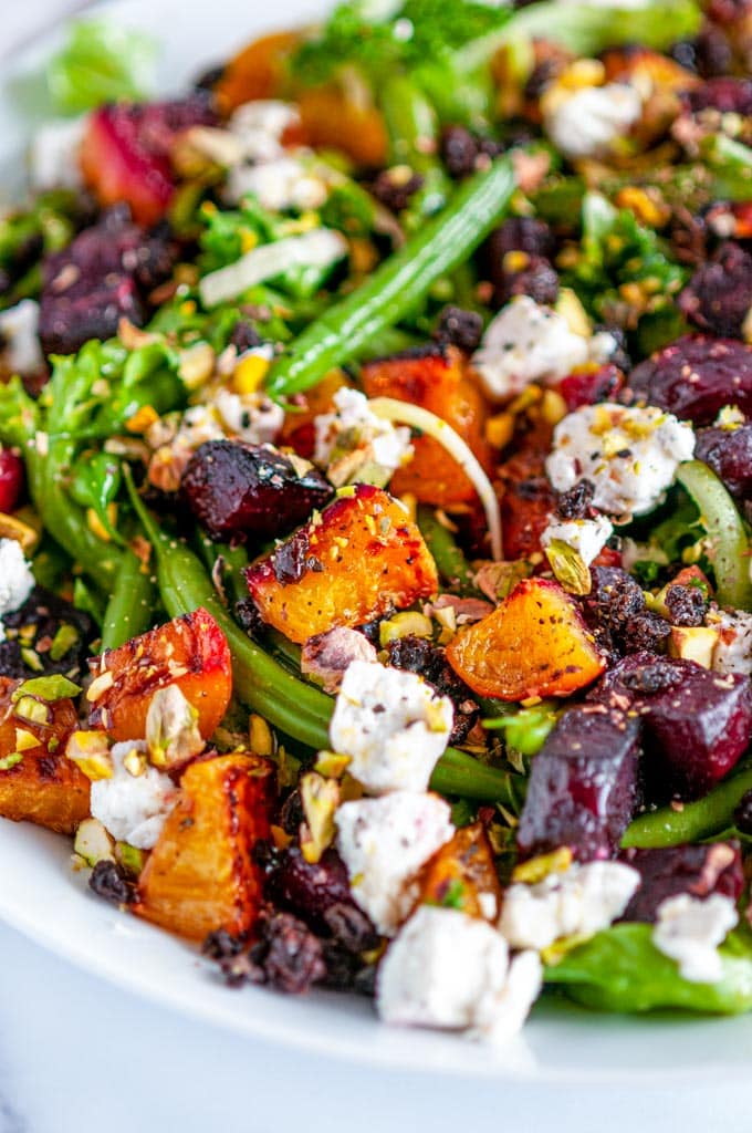 Roasted Beet Green Bean Salad in white bowl on marble