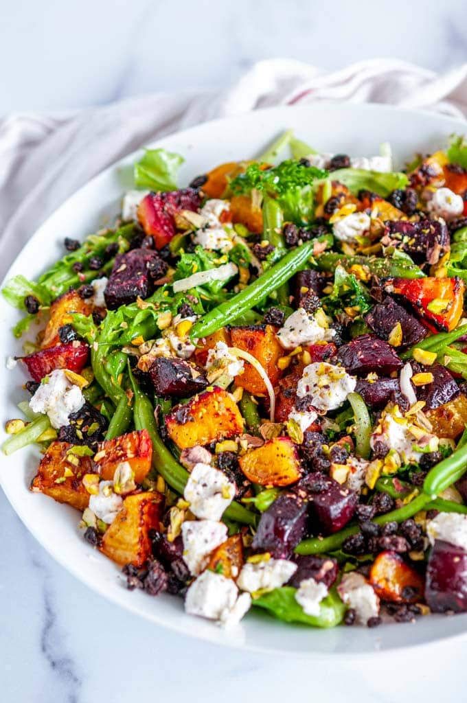 Roasted Beet Green Bean Salad in white bowl on marble