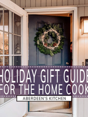 Holiday Gift Guide for the Home Cook Christmas wreath on blue door with lights