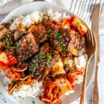Instant Pot Korean Short Ribs on white plate with rice and kimchi