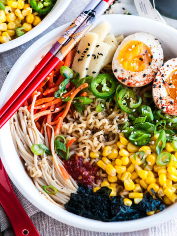 Easy Homemade Ramen with Soft Boiled Eggs in white bowl with chopsticks on marble